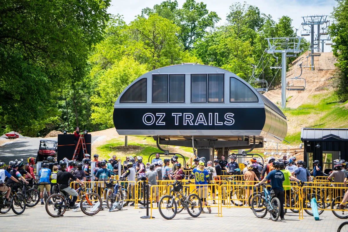OZ Trails Bike Park chairlift opening with riders gathered at the base