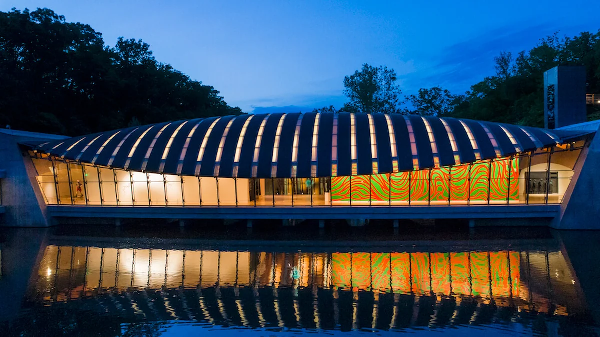 Crystal Bridges Museum of American Art at twilight, reflecting in the pond