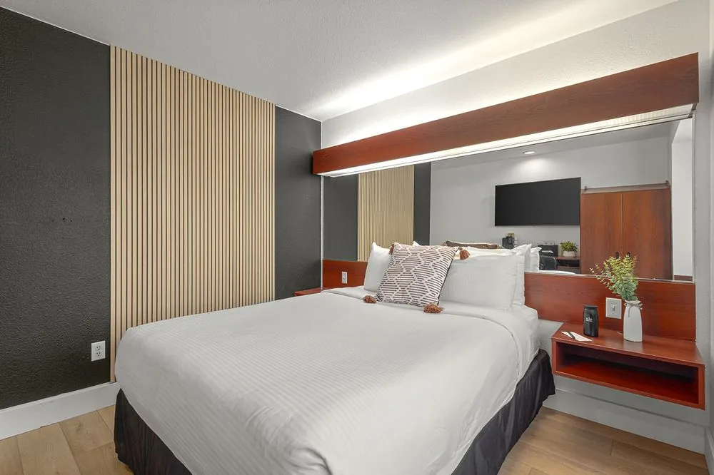 Classic Queen – double queen beds with wood slat accent wall